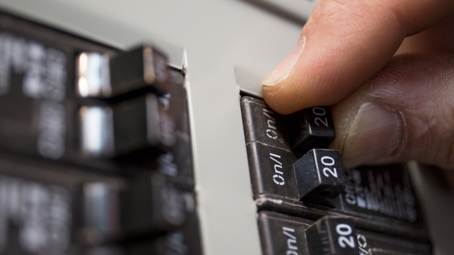 should i turn off circuit breakers over vacation? angie\u0027s listhand switching off an electrical circuit breaker